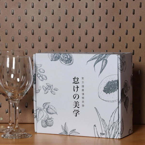 Image shows a colorful mailing box accented by a wine glass