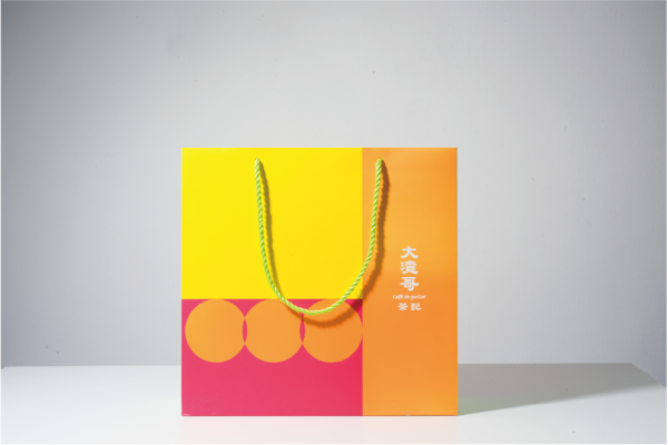 A mockup of a rope paper bag is shown on a gray background