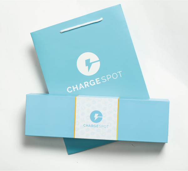 A mockup of a magnetic book-shaped hard box and a round rope hand-held paper bag is shown on a white background