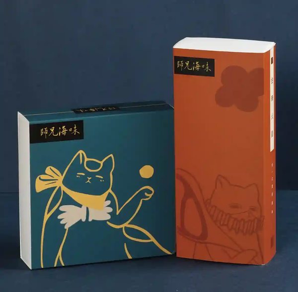 A green cat sleeved folding box and an orange cat sleeved folding box are displayed on a green background.