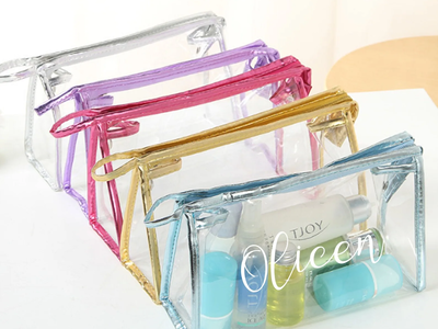 Clear PVC zipper cosmetic bags with silver, purple, pink, gold, and blue trim
