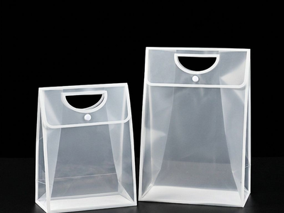 Two frosted PP gift bags with white trim in small and tall sizes on black background